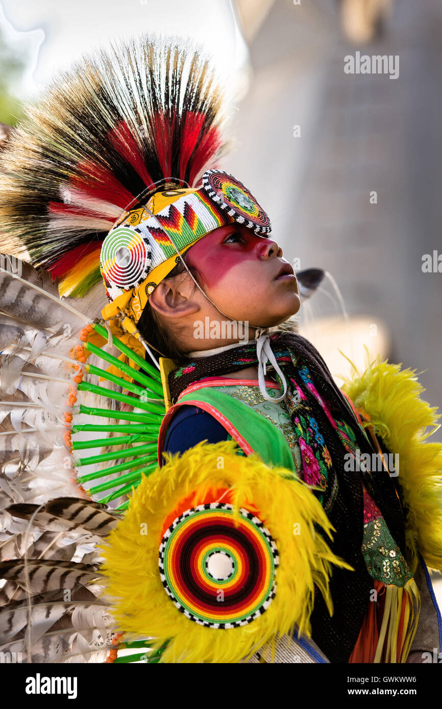 A young Native American dancer from the Arapahoe people dressed in