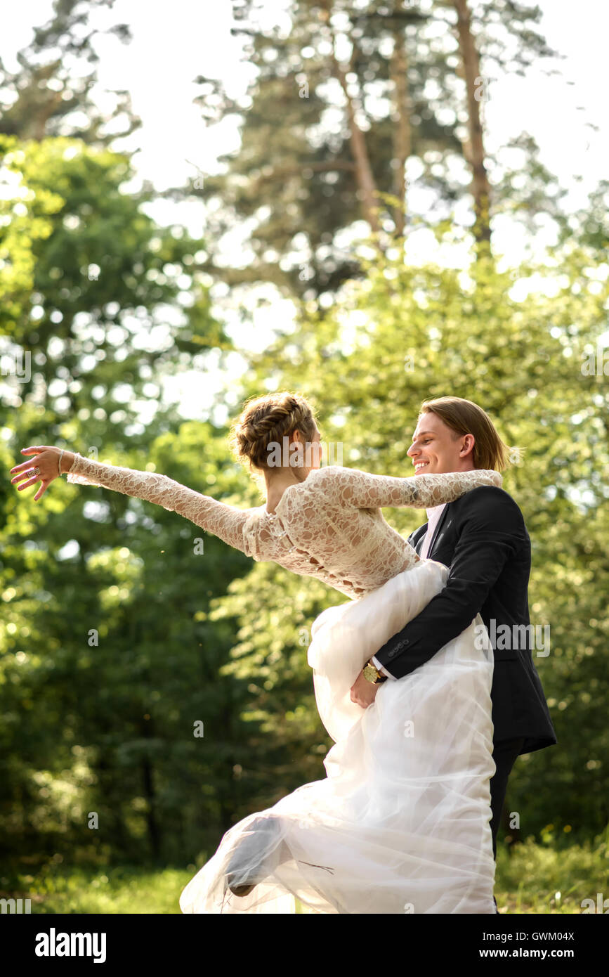 bride and groom in the woods. young couple in the woods Stock Photo - Alamy