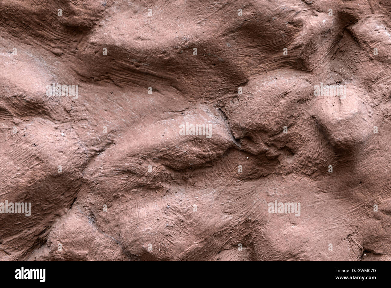 Background of stone wall in the red clay texture Stock Photo