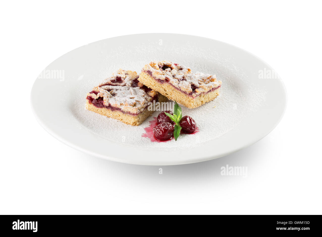 grated pie on a white plate with raspberries. Stock Photo