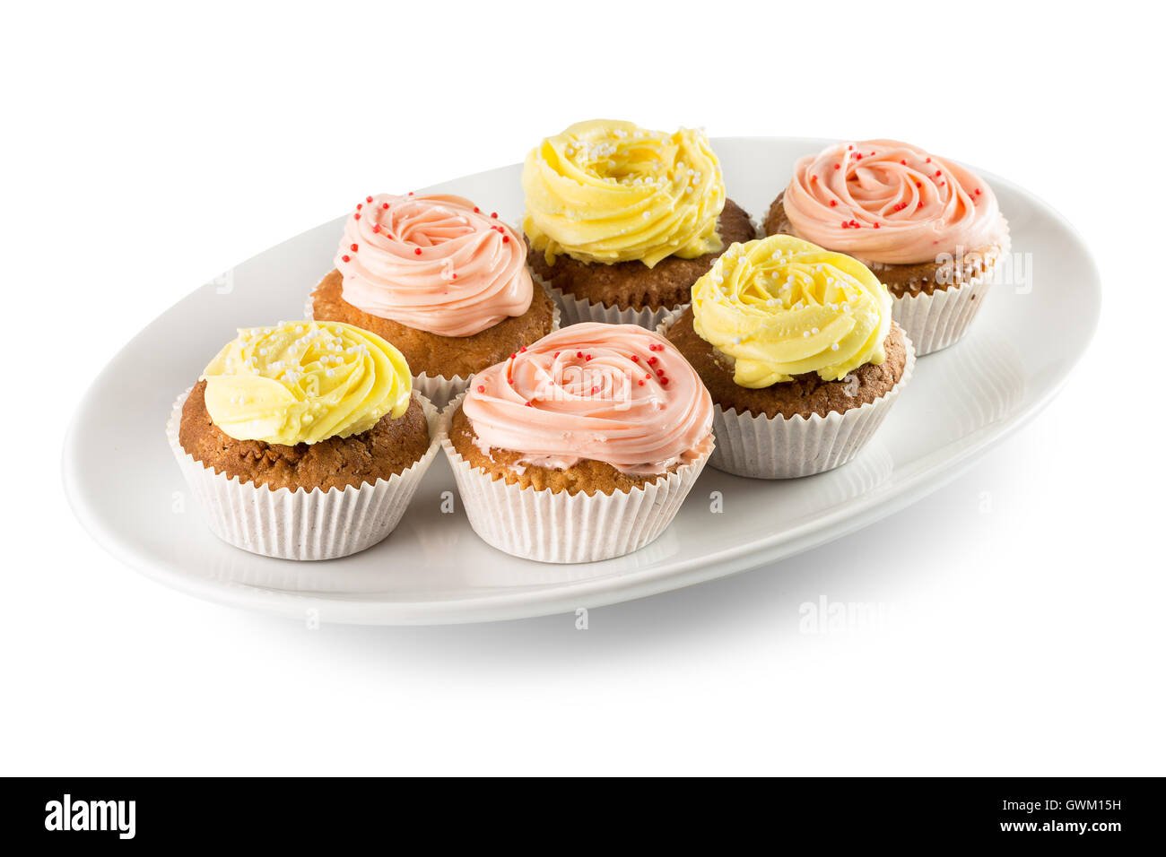 cupcakes with cream on white plate. Stock Photo