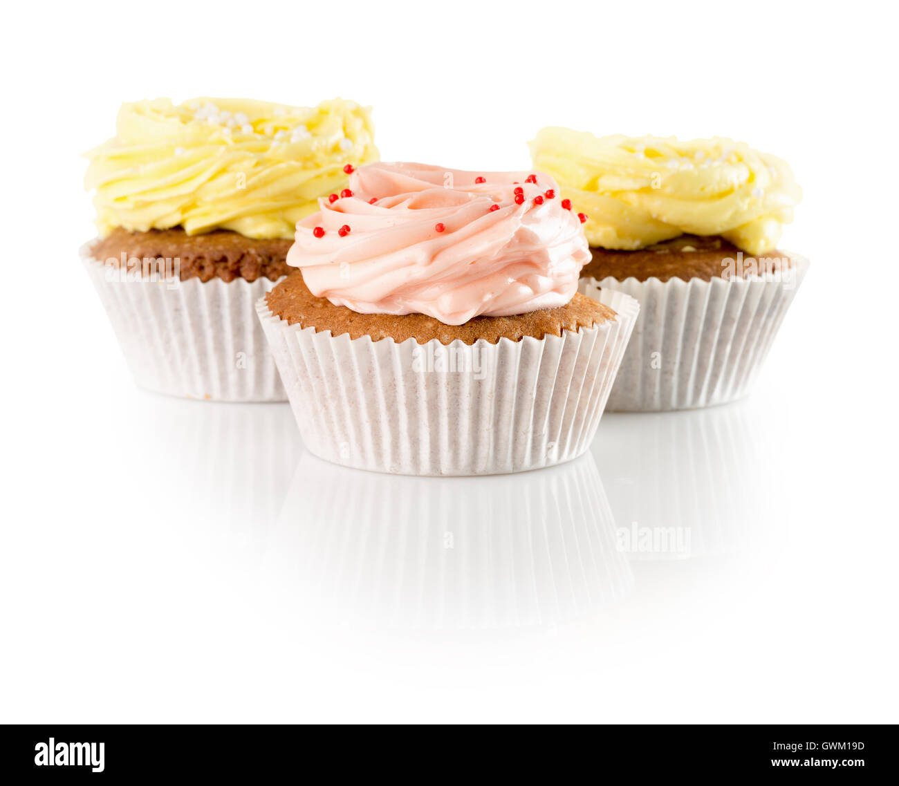 cupcakes with cream isolated on the white background. Stock Photo