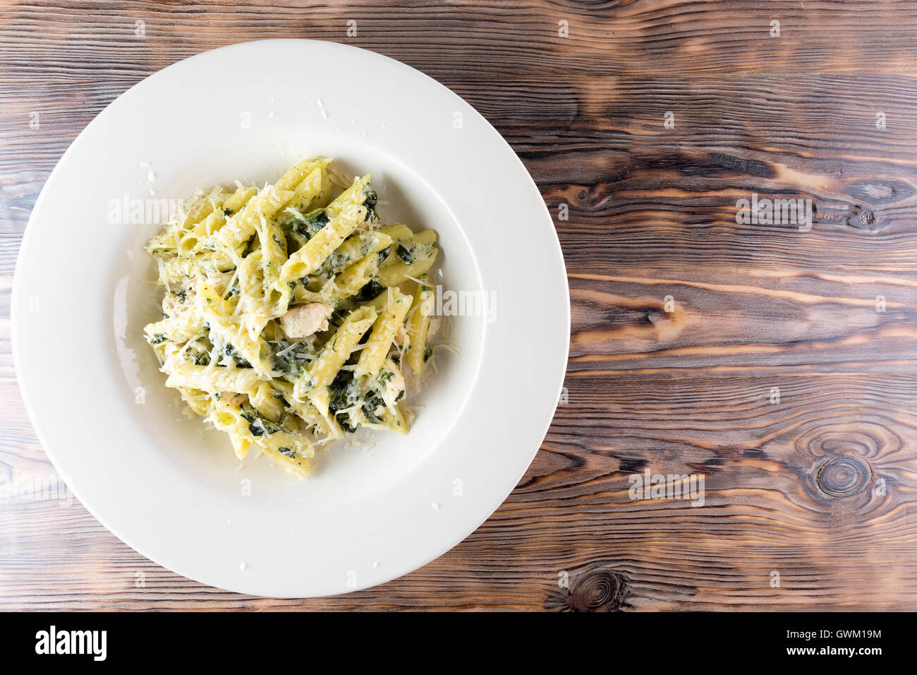 pasta with cheeses on wooden background. Stock Photo