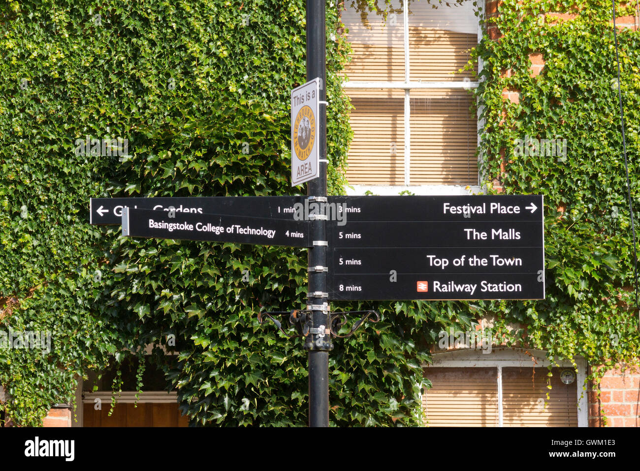 A pedestrian directional signpost in the old market town of Basingstoke Stock Photo