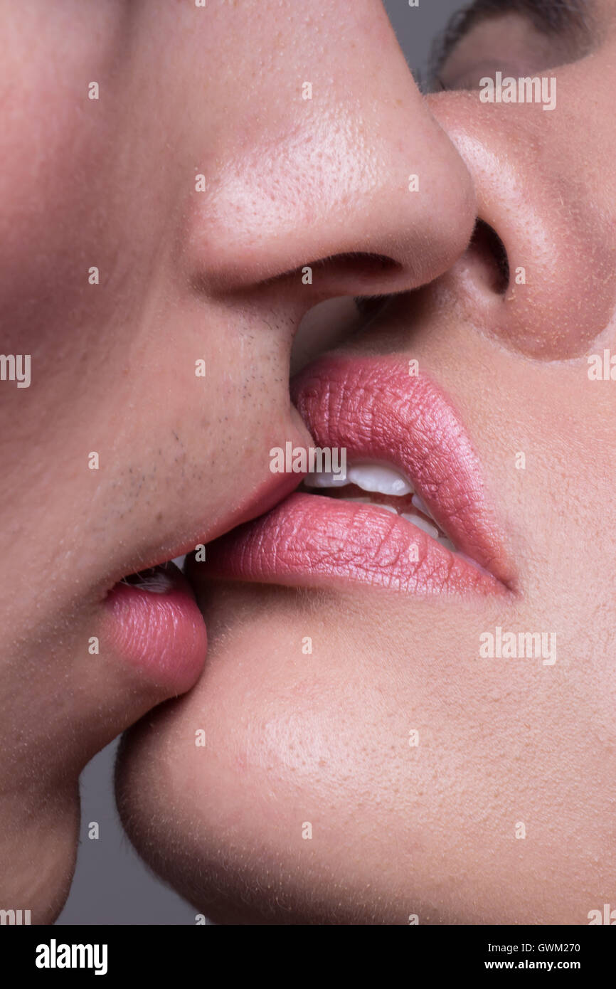 Close-up two lips kissing sensual intimate, man woman girl boy Stock Photo  - Alamy