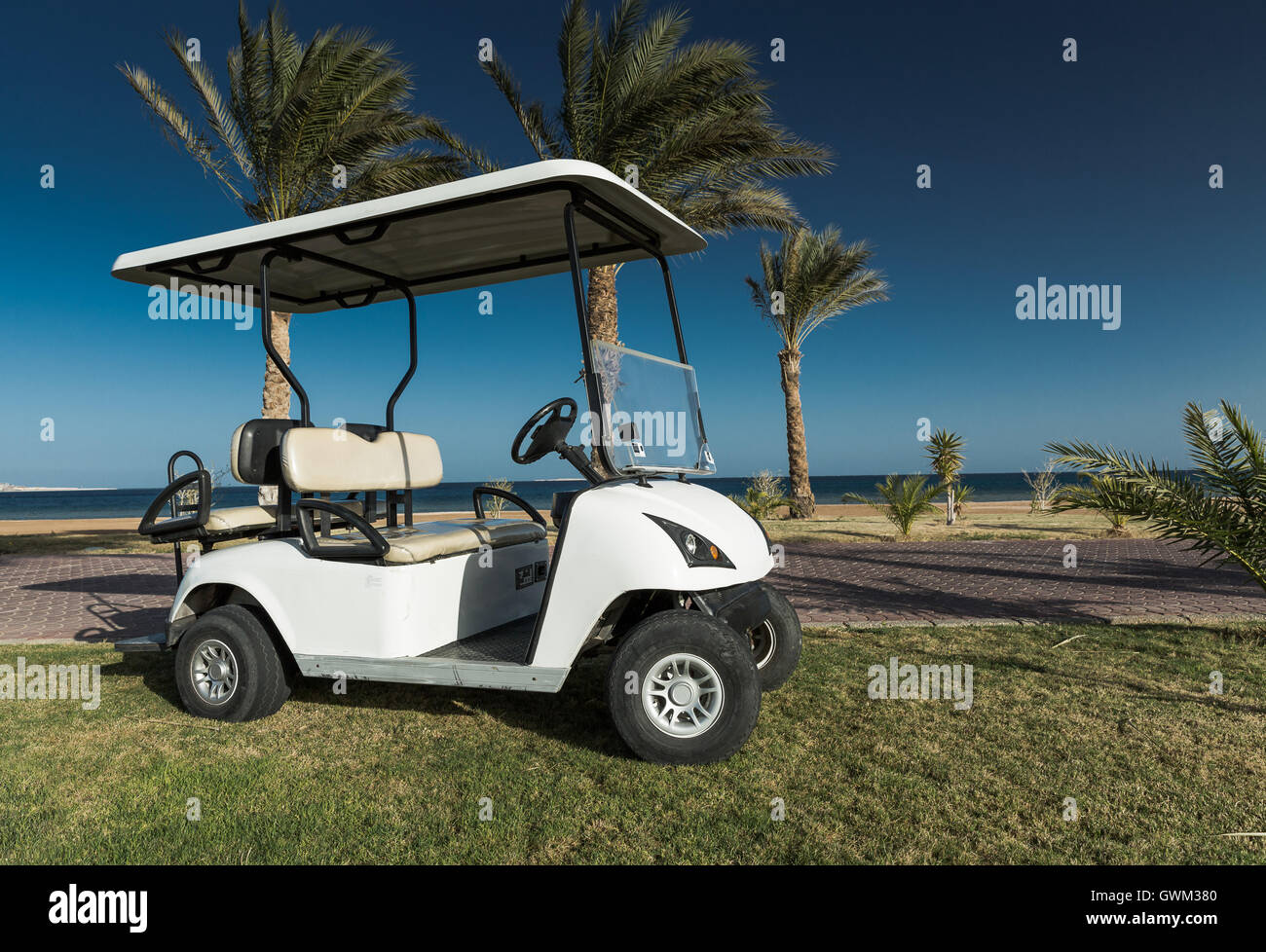 White Golf Electric Car on the lawn Stock Photo