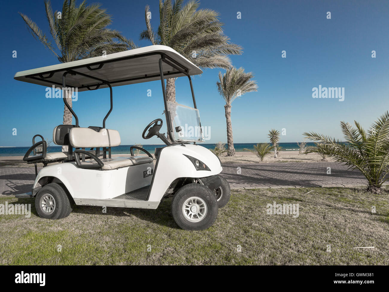 White Golf Electric Car on the lawn Stock Photo