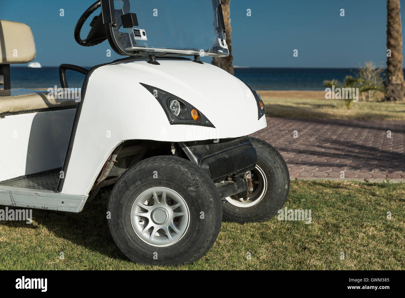 White Golf Electric Car on the lawn Stock Photo