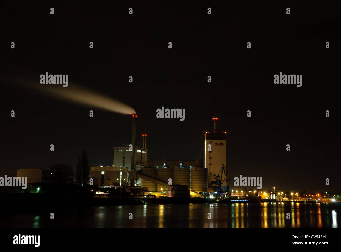 Bremen - view of a power plant next to Weser River at night Stock Photo