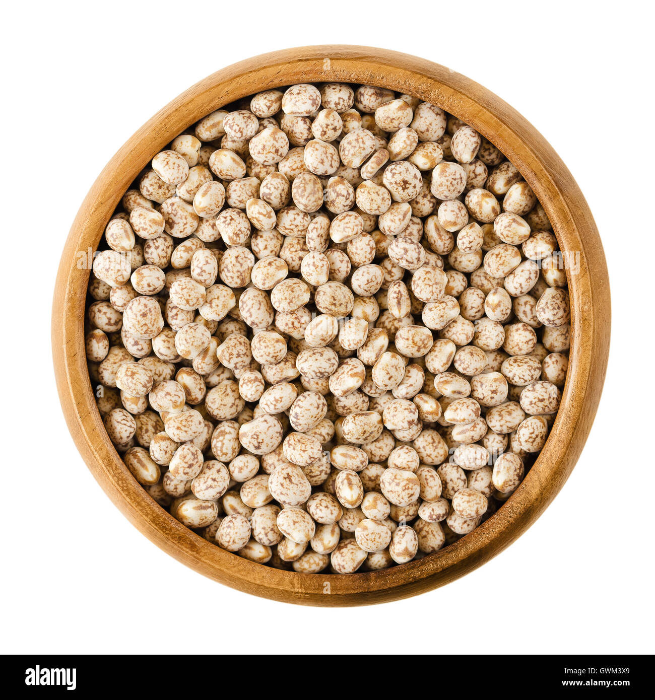 Sweet lupin beans in a wooden bowl on white background, also lupini beans, are the seeds of Lupinum. Edible vegetable. Stock Photo