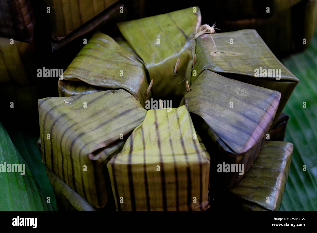 Food wrapped in banana leaf at the market, Thailand Stock Photo Alamy