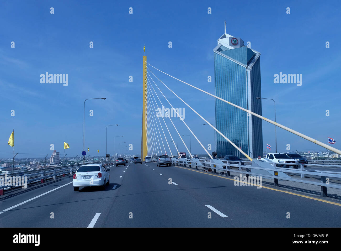 Cars crossing the Bhumibol Bridge also known as the Industrial Ring Road Bridge connecting southern Bangkok with Samut Prakan Province over the Chao Phraya River. Bangkok Thailand Stock Photo