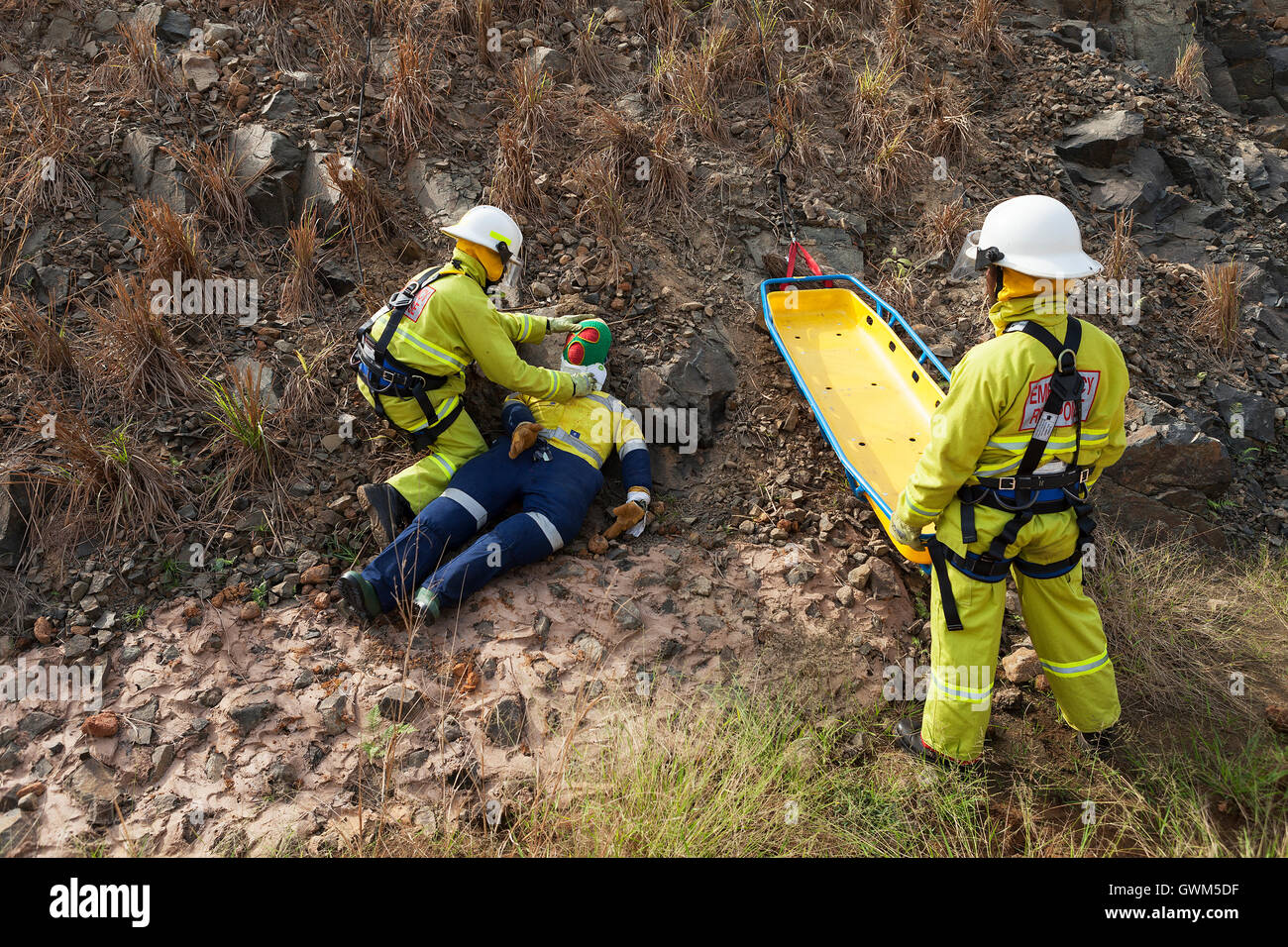 Employed Sierra Leoneans from emergency response team on iron ore project, undergoing rescue technique training exercise on railway embankment. Stock Photo