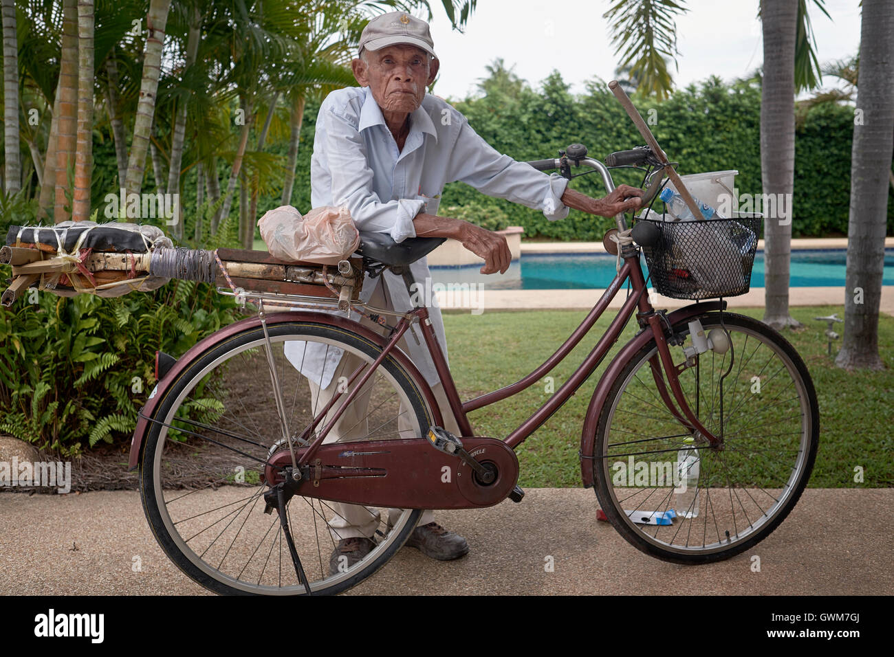Thailand senior. 75 year old elderly Thai man with his bicycle. Thailand S. E. Asia Stock Photo