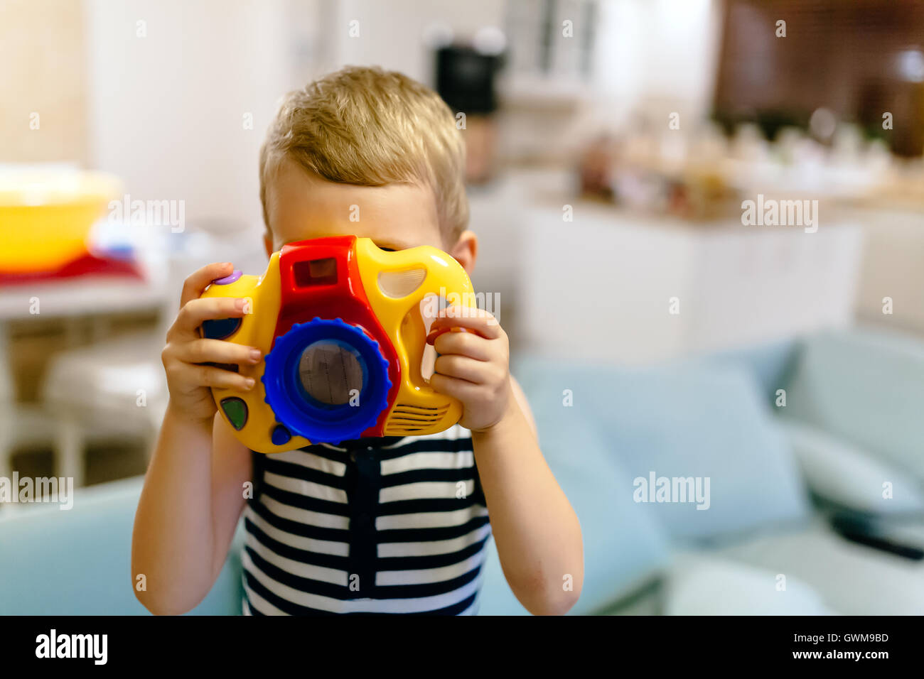 Cute boy wants to become photographer Stock Photo