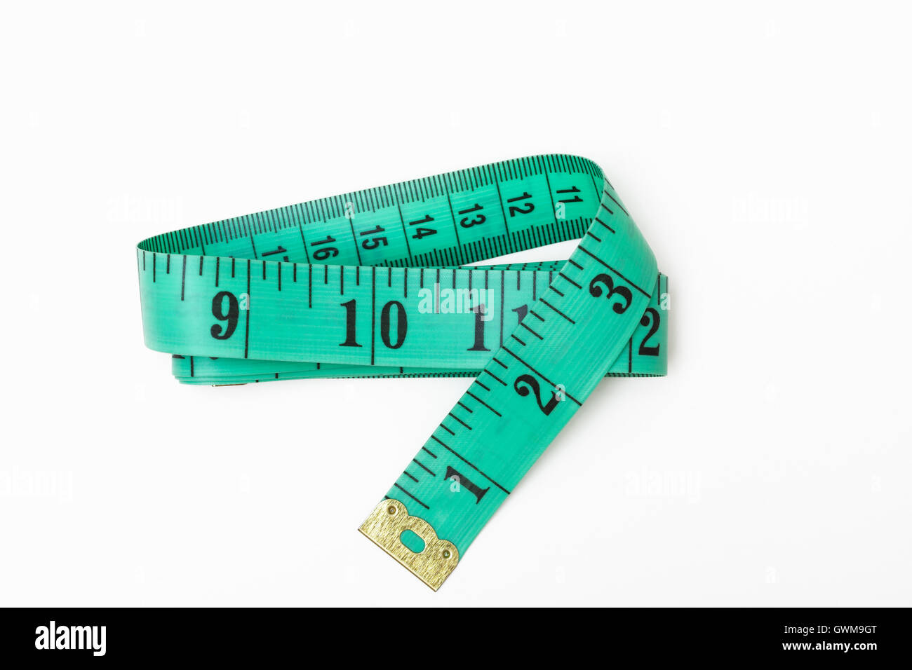 A green tape measure folded Stock Photo