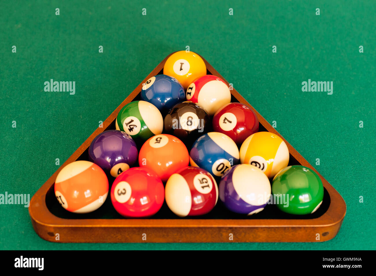Pool balls ordered in a rack ready for a game of eight-ball pool Stock Photo