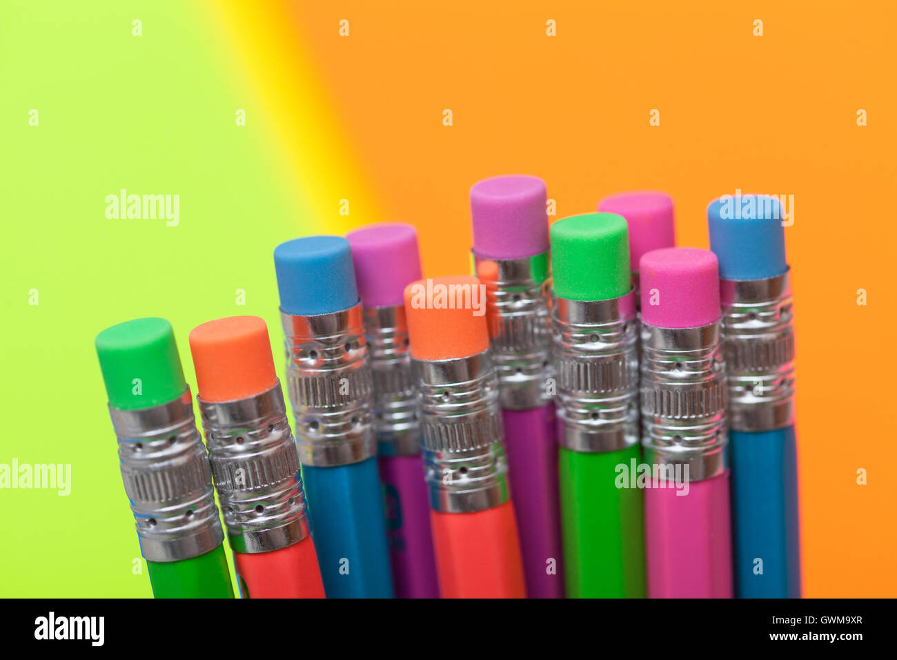 Colorful pencils against a background of colorful poster board Stock Photo