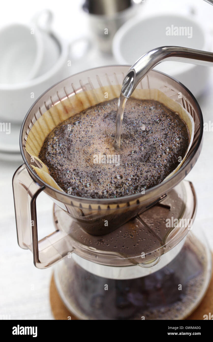 making hand drip coffee by paper filter Stock Photo