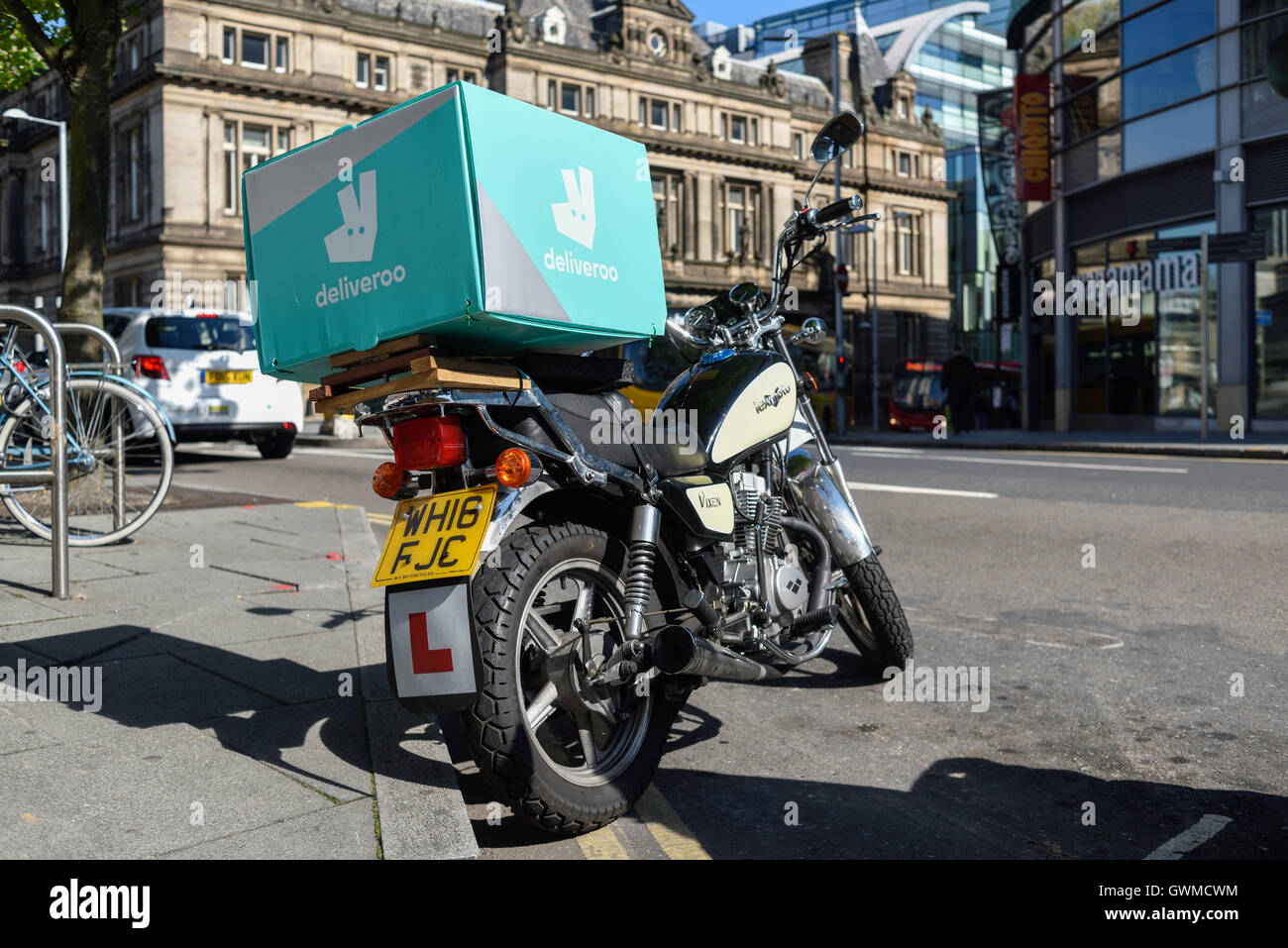 Deliveroo Food Courier Delivery Services. Stock Photo