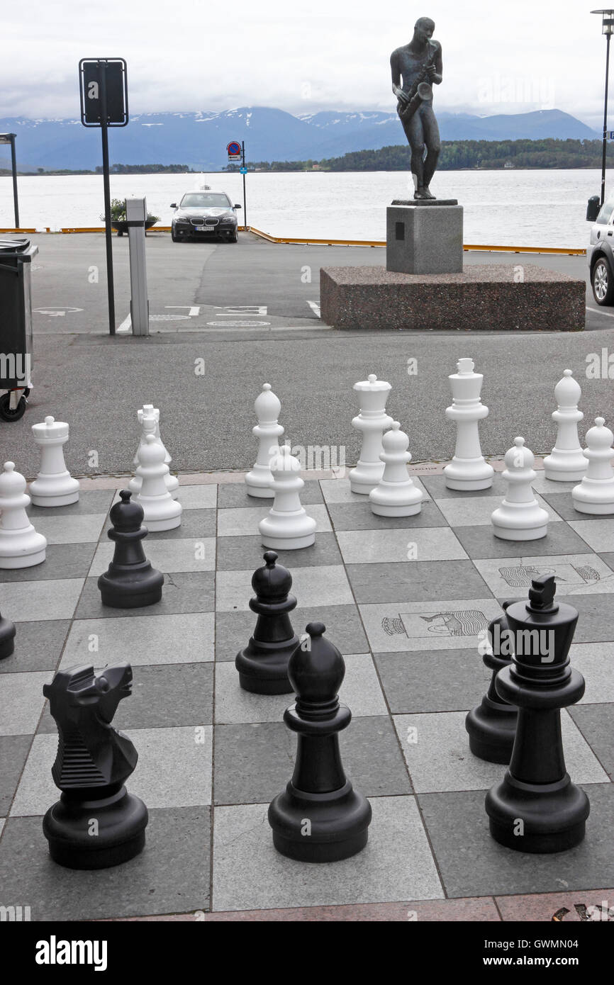 Saxaphonist statue and chess pieces Molde, Norway Stock Photo