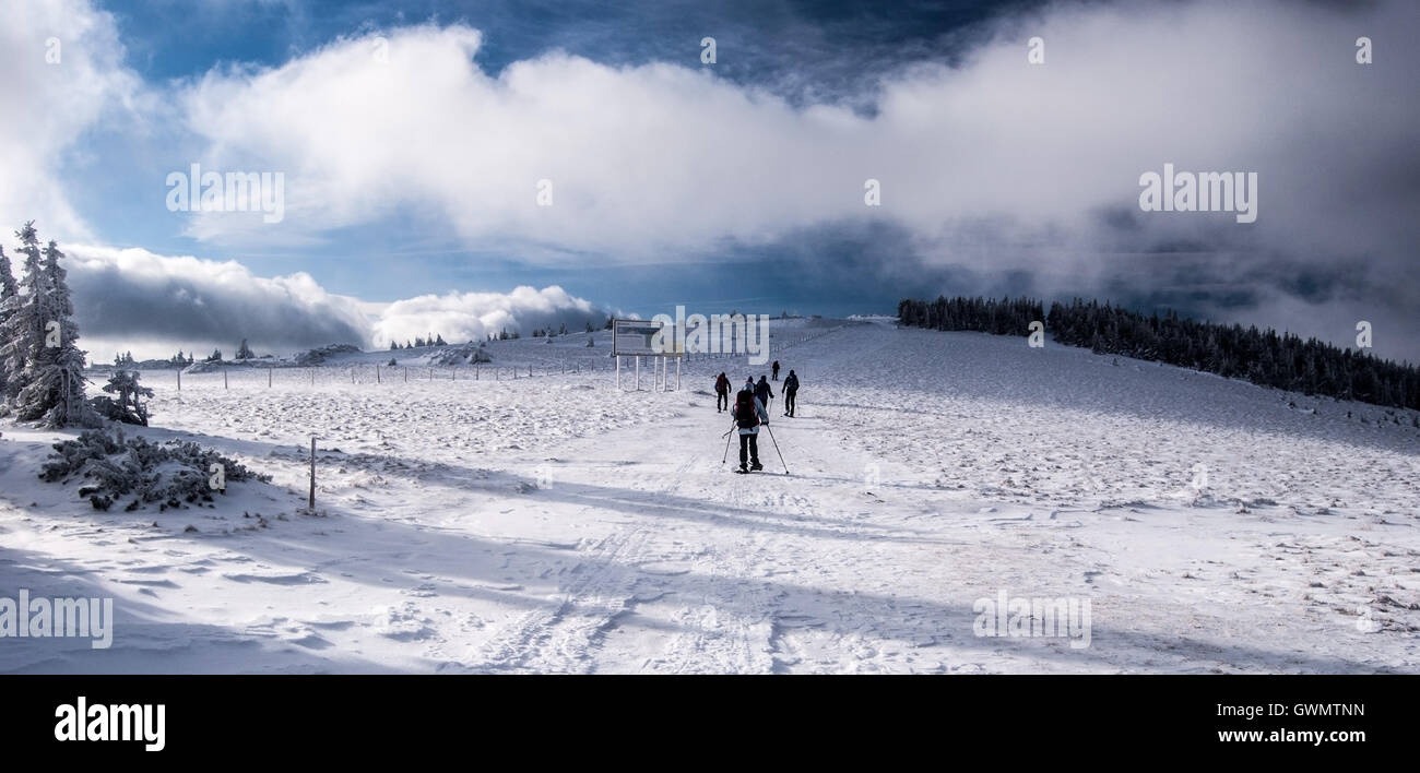 snowshoeing on Stuhleck mountain ridge in winter Fischbacher Alpen
