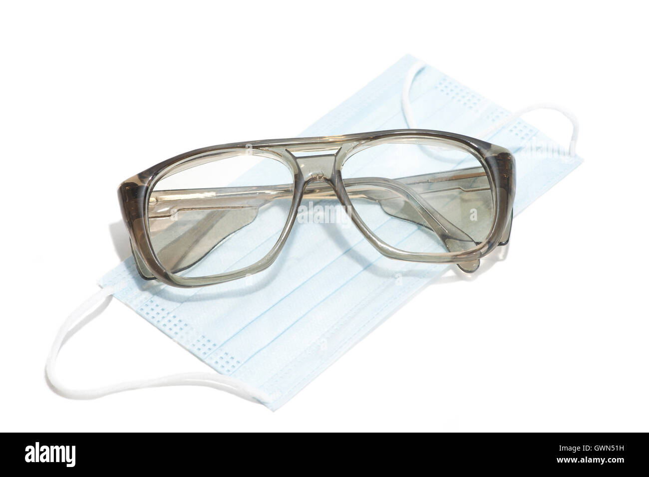 Safety glasses and mask for personal protection during medical procedures. Stock Photo