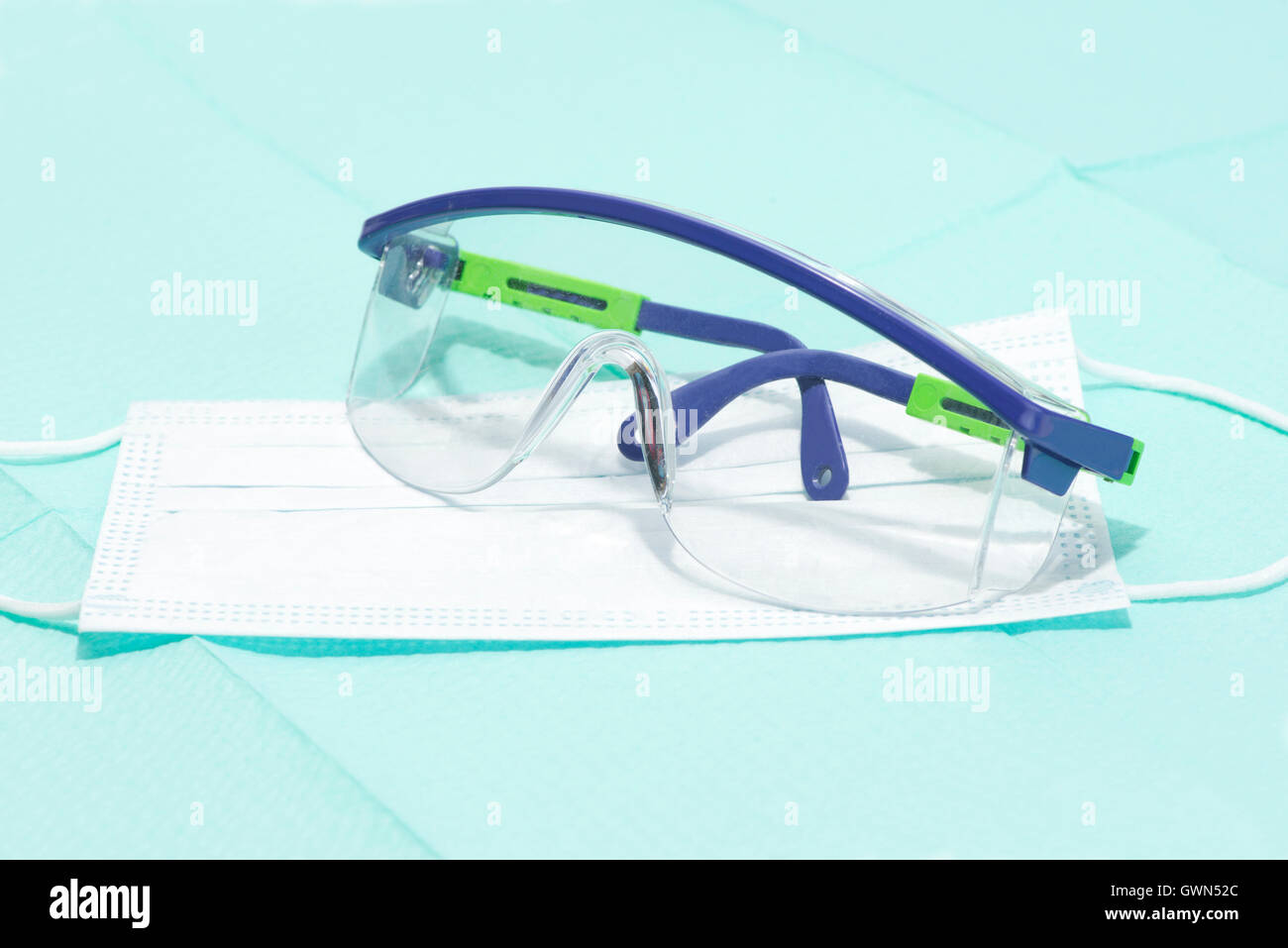 Safety glasses and mask on sterile drape for personal protection during medical procedures. Stock Photo