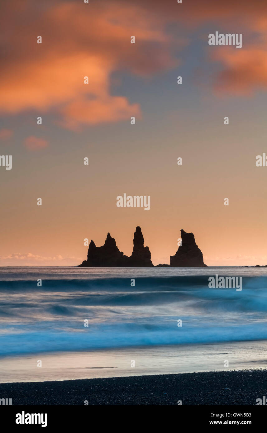 Silhouetted Reynisdrangar Rock Pillars at Sunset, Vik i Myrdal, Southern Iceland Stock Photo