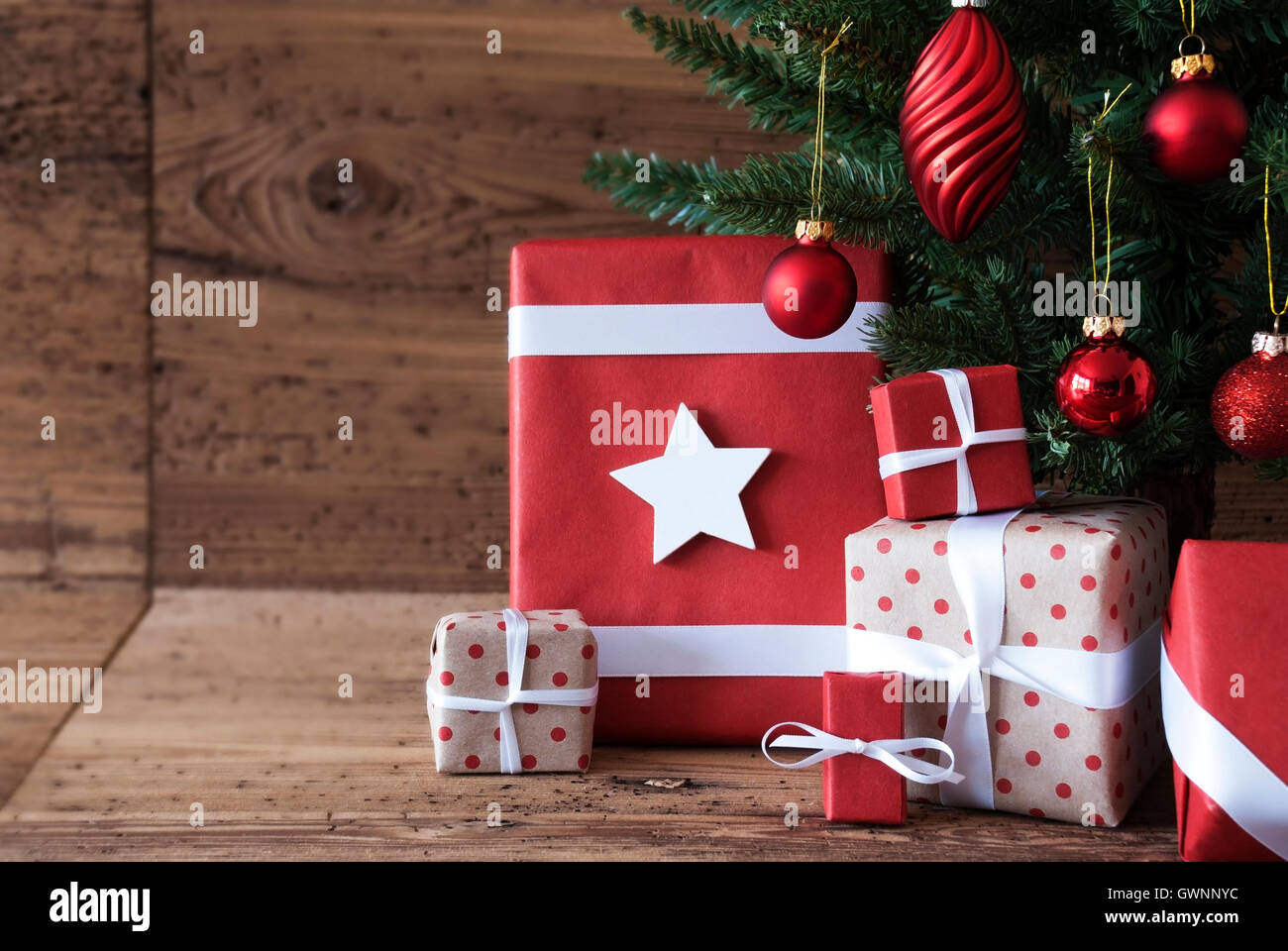 Christmas Tree With Presents And Balls Stock Photo - Alamy