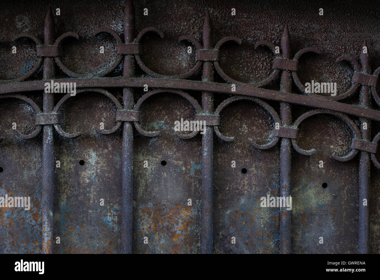 Fragment of old metal gate with ornate wrought iron grid. Toulouse, France. Stock Photo