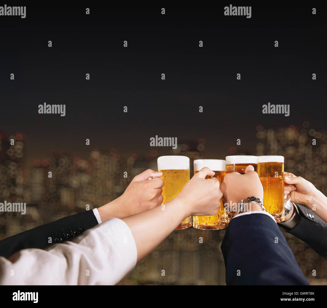 Group of young Japanese friends toasting with beer Stock Photo