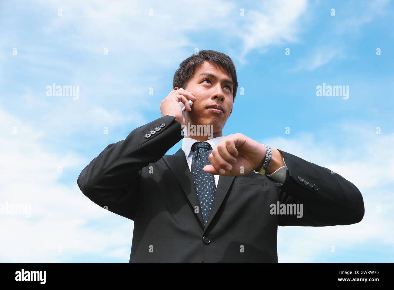 Young Japanese businessman on the phone Stock Photo