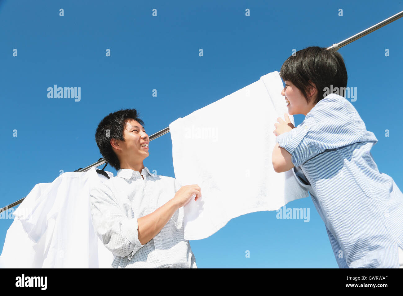 Young Japanese couple doing laundry Stock Photo Alamy