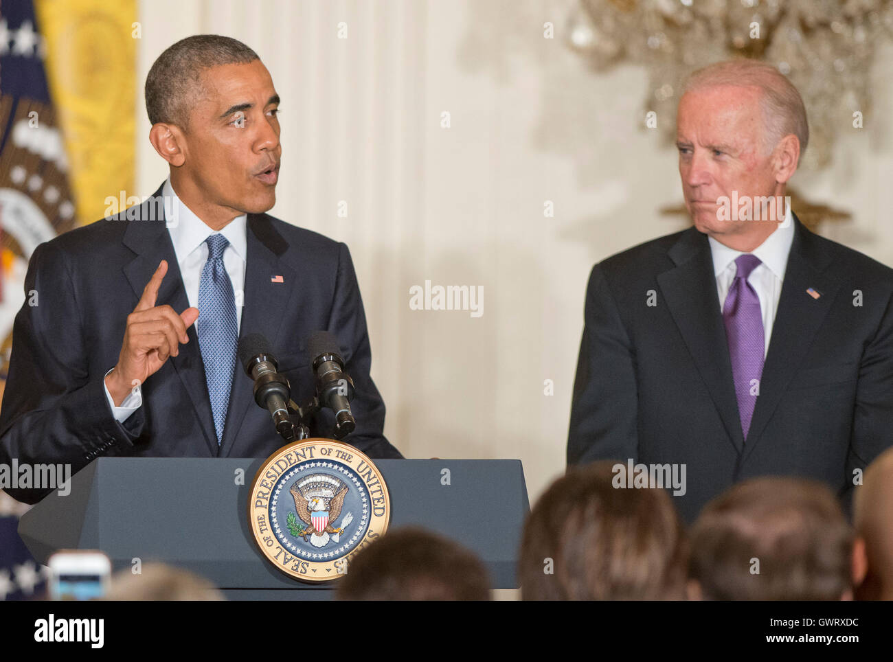 United States President Barack Obama makes remarks as US Vice President Joe Biden looks on from right, at a reception for the 25th Anniversary of the White House Initiative on Educational Excellence for Hispanics in the East Room of the White House in Was Stock Photo