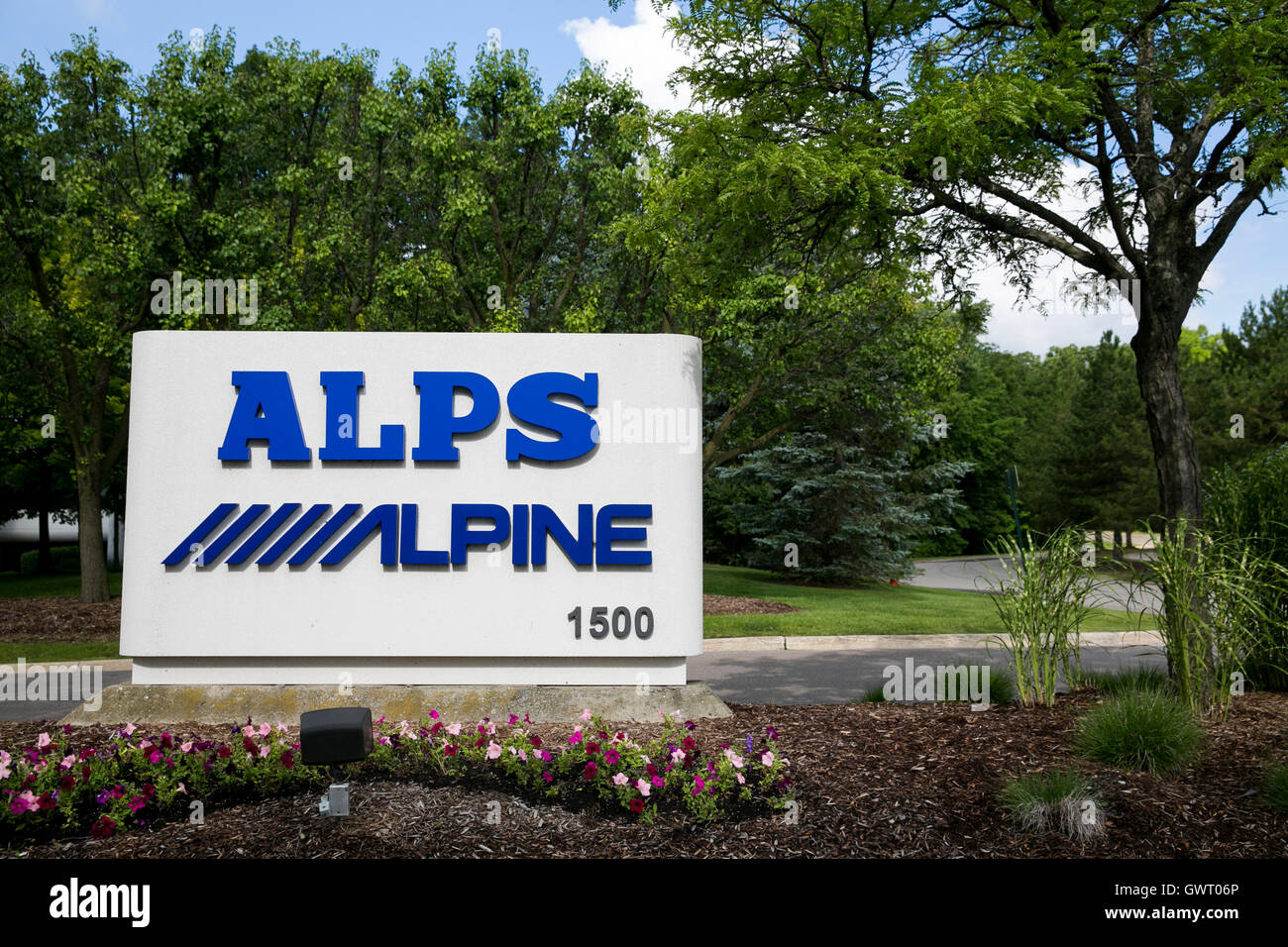 A logo sign outside of a facility occupied by Alps Electric Co., Ltd., and Alpine Electronics, Inc., in Auburn Hills, Michigan o Stock Photo