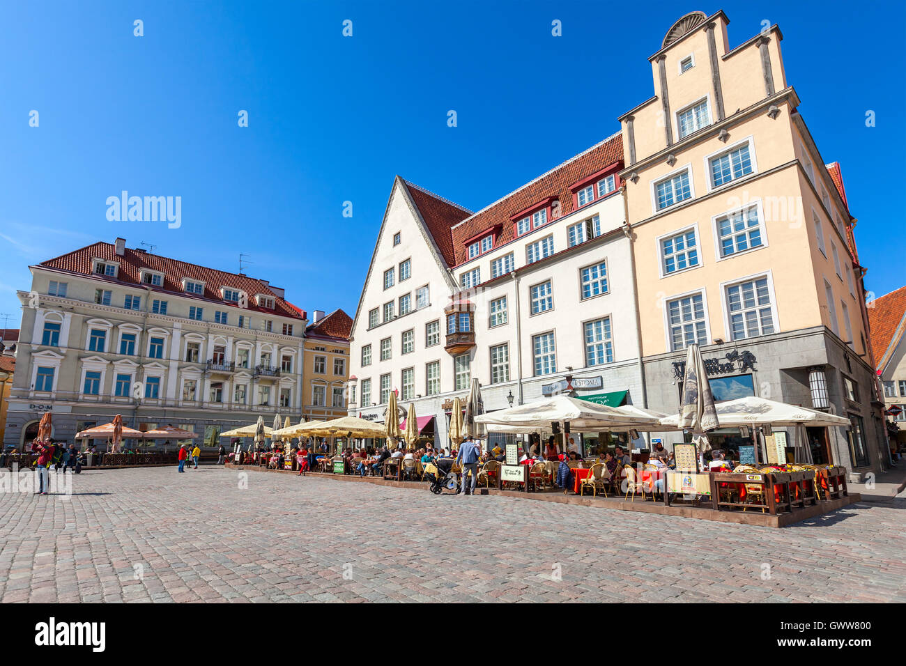 Tallinn, Estonia - May 2, 2016: Tourists in restaurants on Town Hall square in old Tallinn Stock Photo