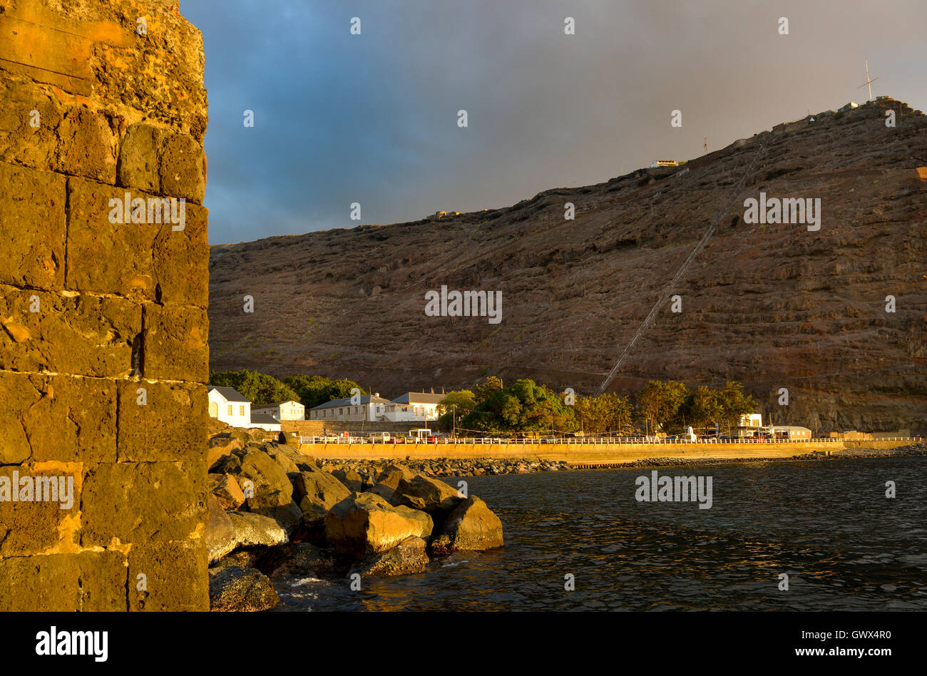 Jamestown St Helena showing Jacobs Ladder staircase up to the fort with Jamestown the capital of the island at sunset Stock Photo