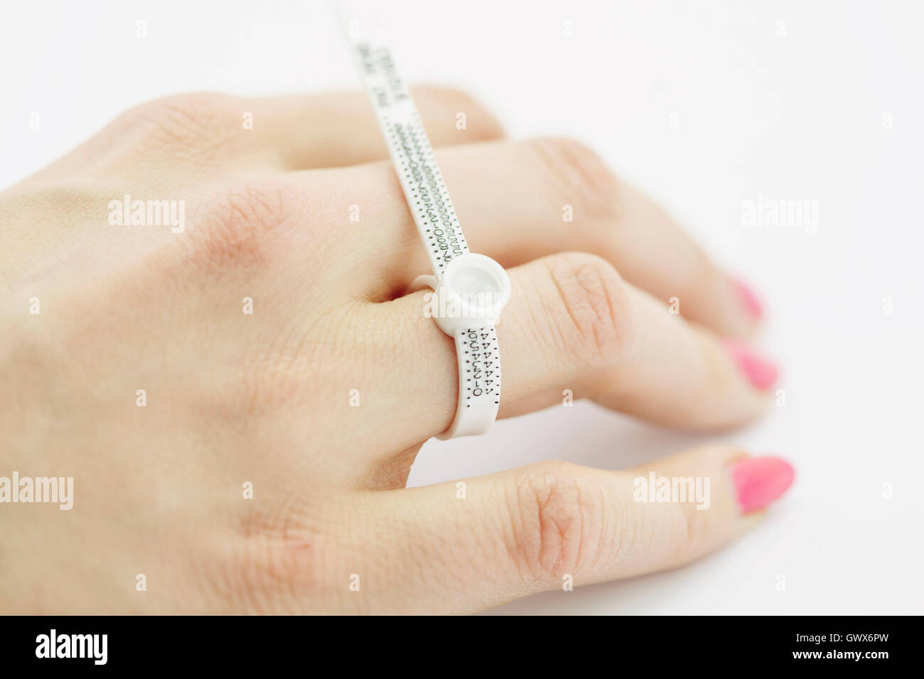 Female hand measuring a finger size Stock Photo Alamy