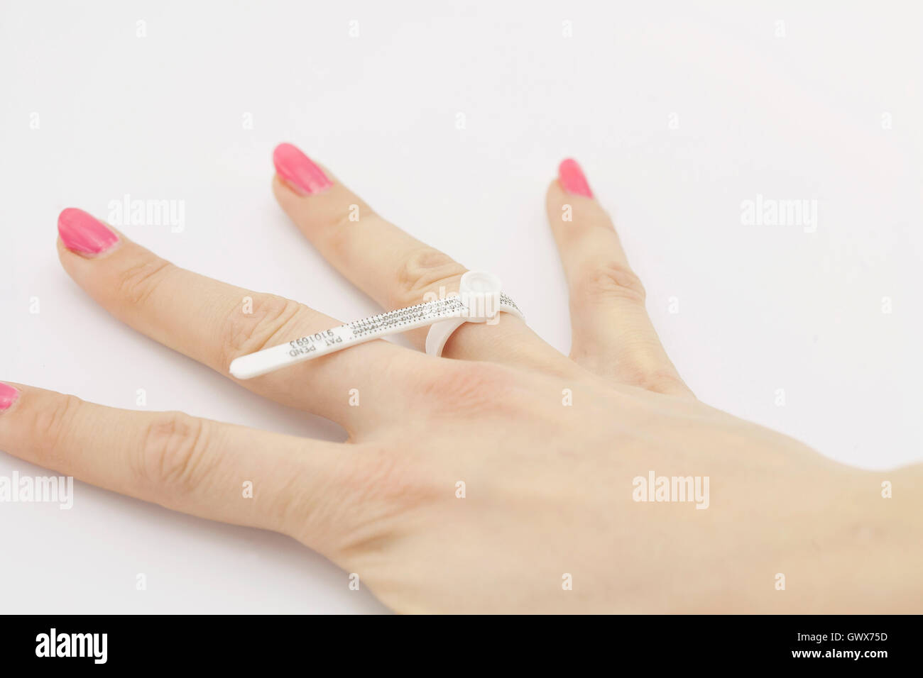 Female hand measuring a finger size Stock Photo Alamy