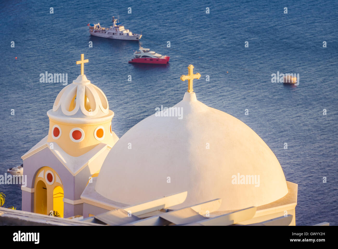 Iconic church of Santorini, Greece. Santorini is an ancient volcano located in the middle of the mediterranean sea, surrounded b Stock Photo