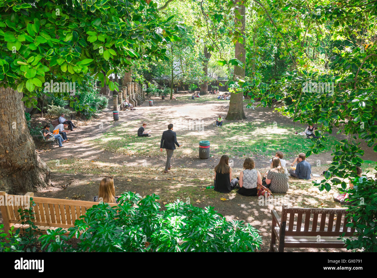 London garden square, view of people in summer relaxing in the Malet Street Gardens in Bloomsbury at lunch-time, central London, UK. Stock Photo