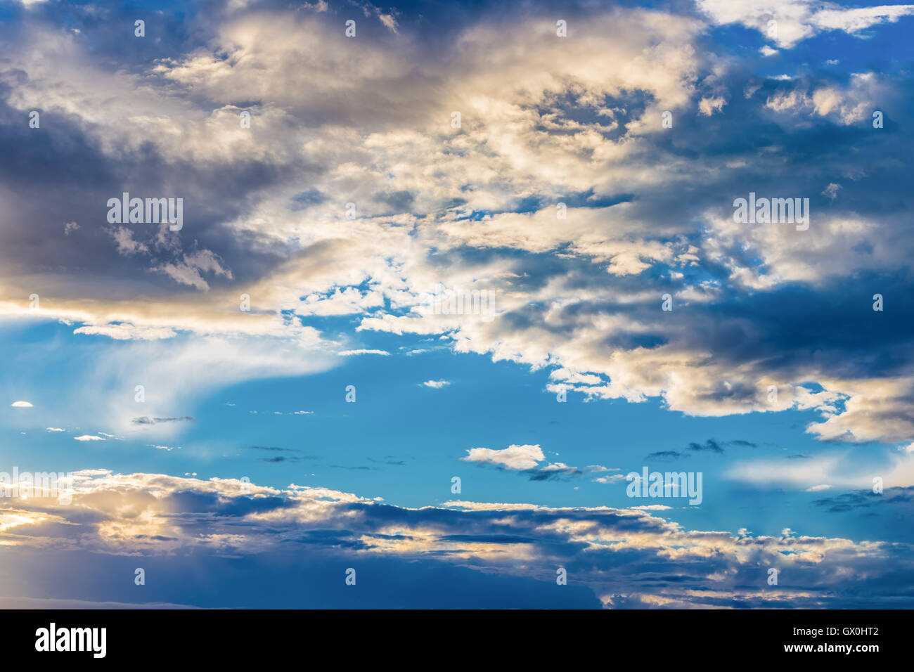 Blue cloudy sky at sunset Stock Photo - Alamy