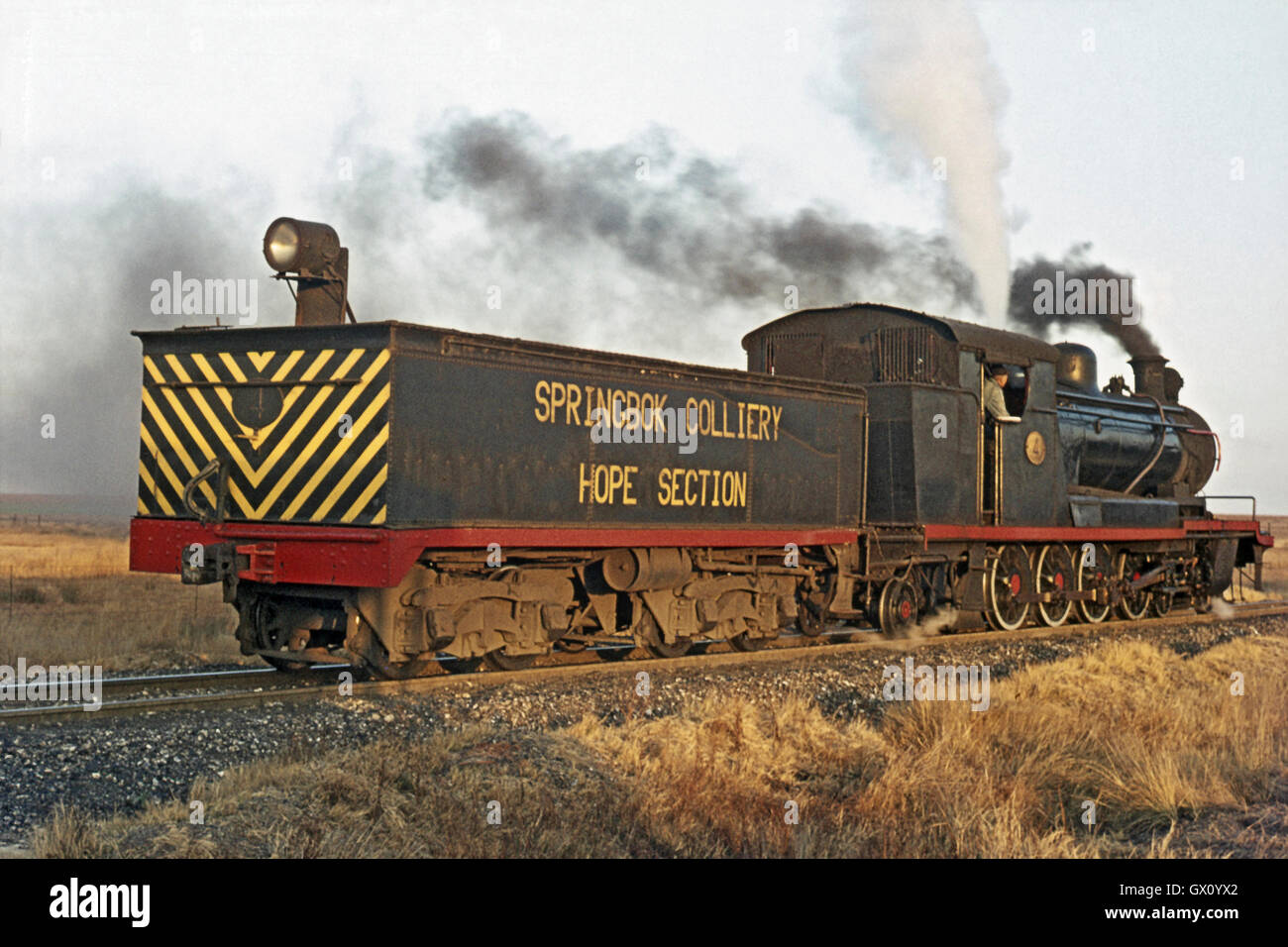 This south African 4-8-0 is a rebuild of a North British-built 4-8-2T. The extra large tender was manufactured locally, Stock Photo
