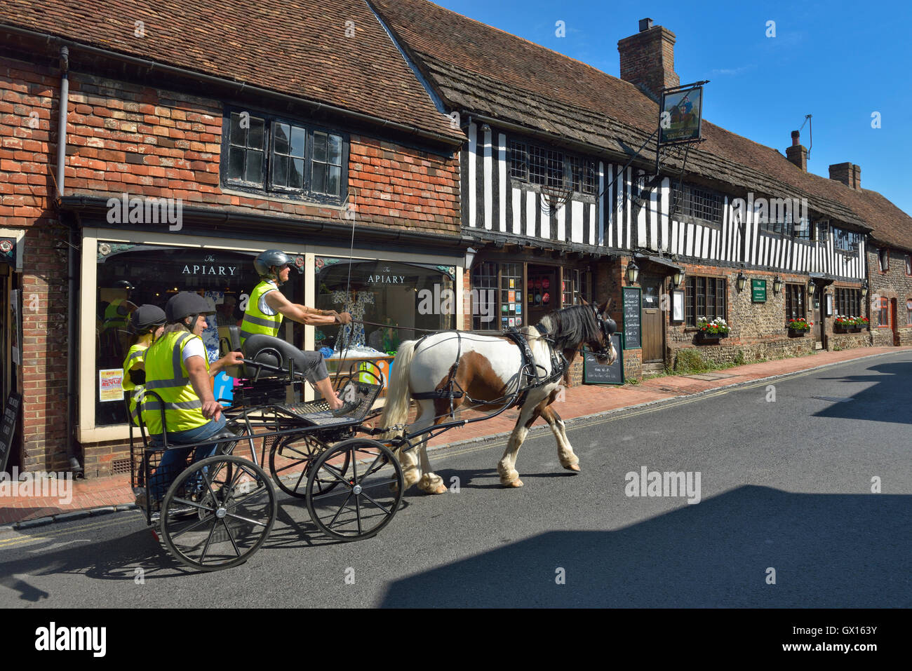 Horse drawn carriage, Alfriston village. East Sussex. England. UK Stock Photo