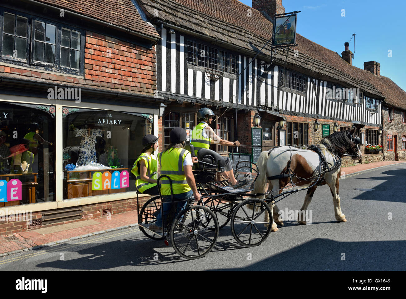 Horse drawn carriage, Alfriston village. East Sussex. England. UK Stock Photo