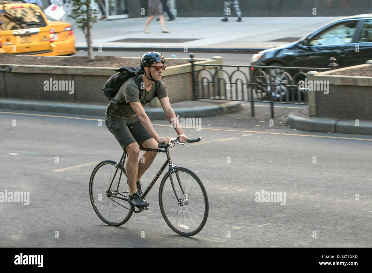A man riding a bicycle. Stock Photo