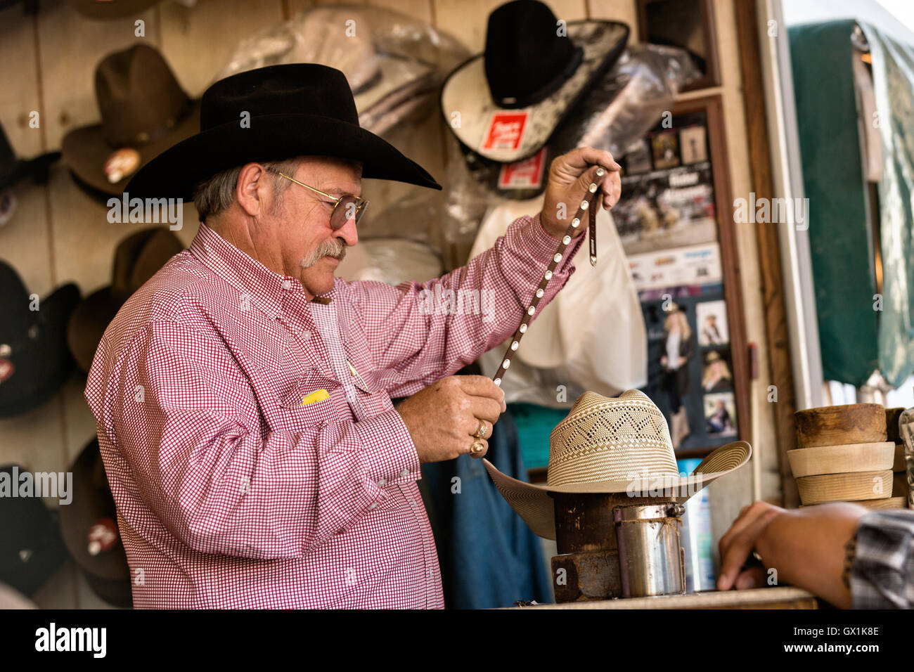 A hat shaper works on customizing a 