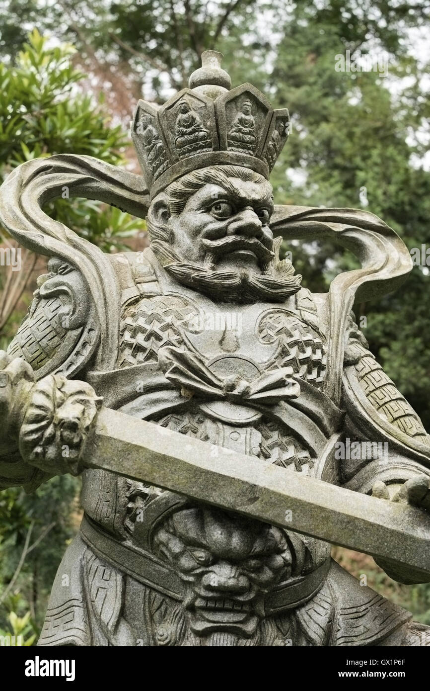 Aged asian god statue Stock Photo Alamy
