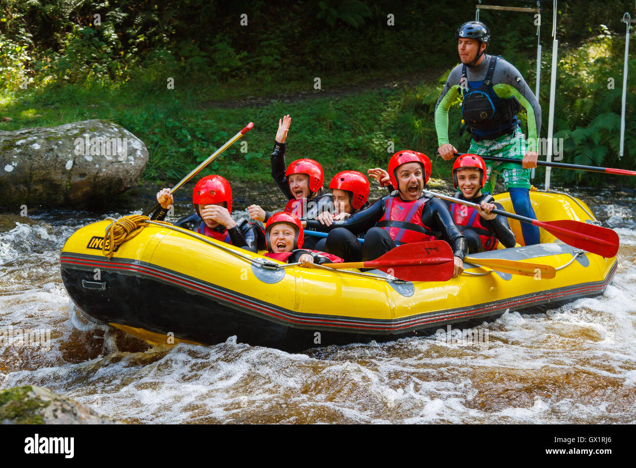 White water rafters having had a good soaking at the National White Water Centre on the River Tryweryn outside Bala North Wales Stock Photo
